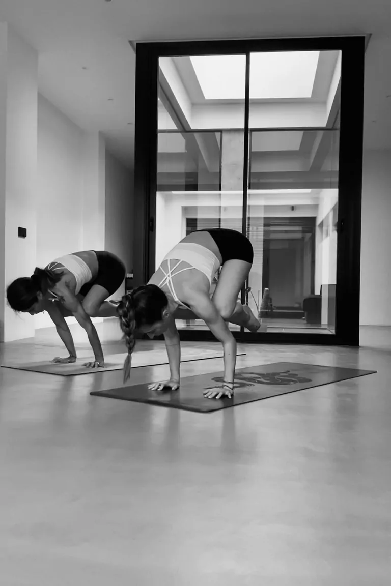 Two yoga teacher doing a practise in a shala
