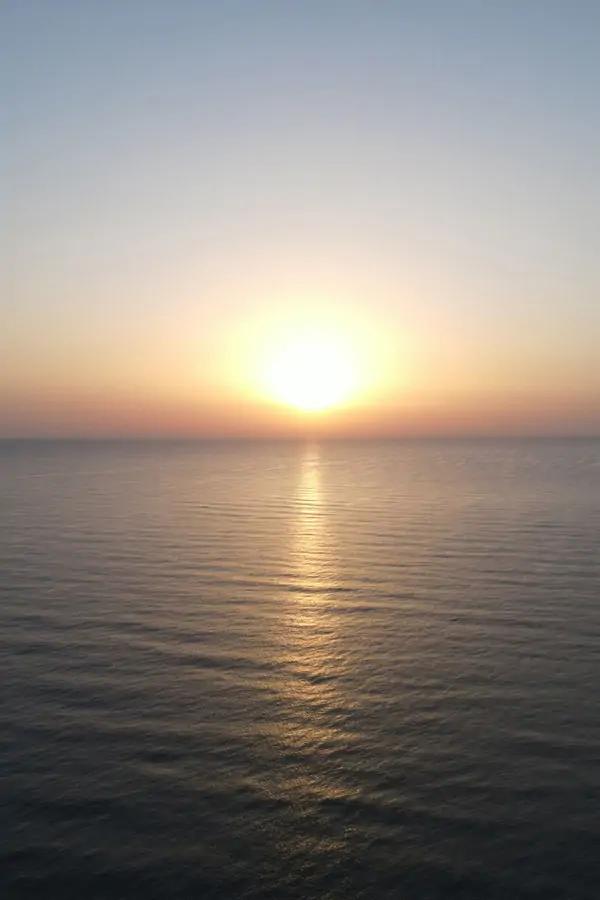 a sunset in the sea of south spain, where oliva beach at Suniai Retreat Center