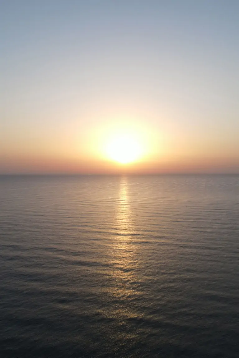 a sunset in the sea of south spain, where oliva beach at Suniai Retreat Center