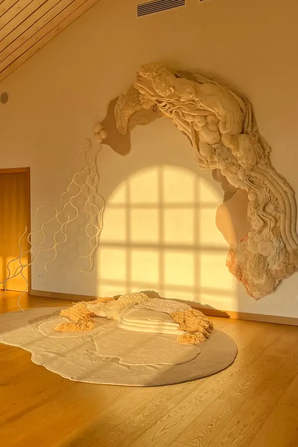 A serene yoga sala at Suniai Oliva Retreat Center in Spain, featuring warm sunlight and artistic decor, perfect for retreats.