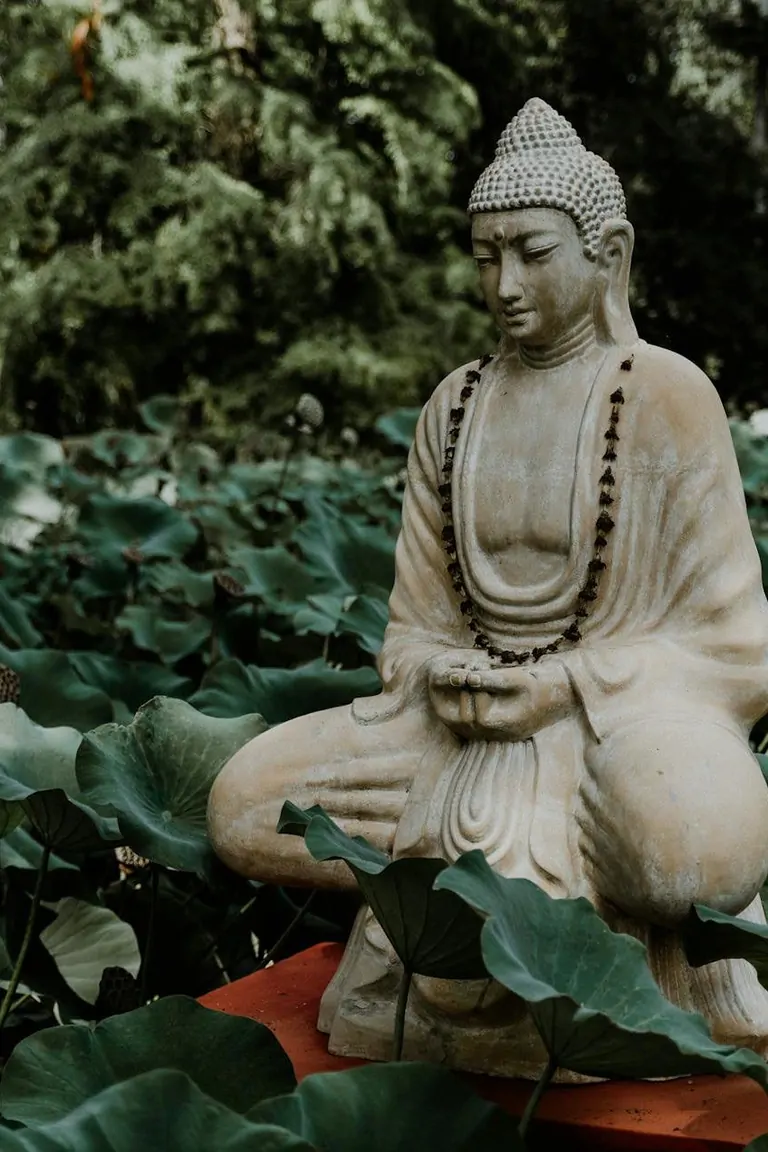 A vibrant gathering of people enjoying a meal, featuring fresh dishes at Suniai Oliva Retreat Center's communal table.