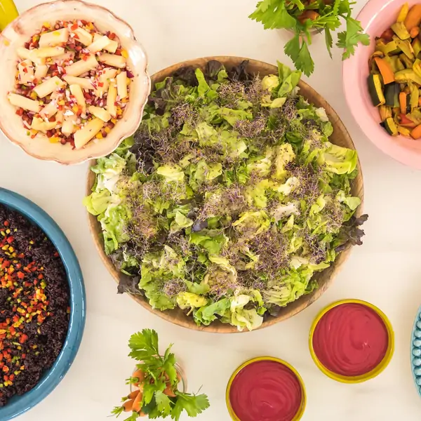 A colorful spread of fresh dishes at the Suniai Oliva Retreat Center in Spain, showcasing delightful Food & Kitchen offerings.